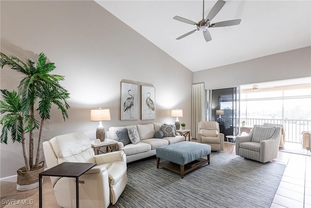 living area with high vaulted ceiling and a ceiling fan