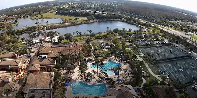 birds eye view of property with a water view