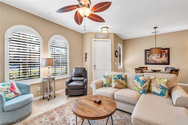 tiled living room featuring ceiling fan