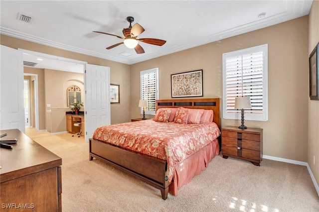 bedroom featuring crown molding, multiple windows, ceiling fan, and light carpet