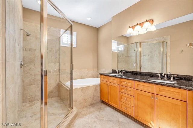 bathroom with vanity, a wealth of natural light, tile patterned floors, and shower with separate bathtub