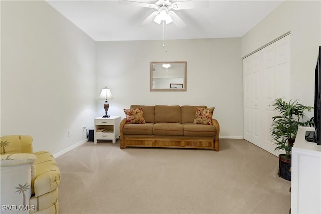 living room featuring ceiling fan and carpet flooring