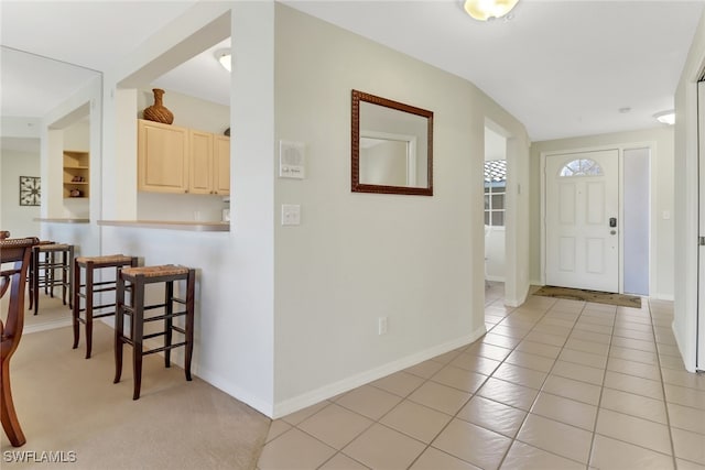 entrance foyer featuring light tile patterned flooring