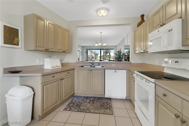 kitchen featuring sink, white appliances, a chandelier, and light brown cabinets