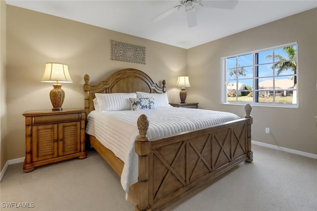 bedroom with ceiling fan and light colored carpet