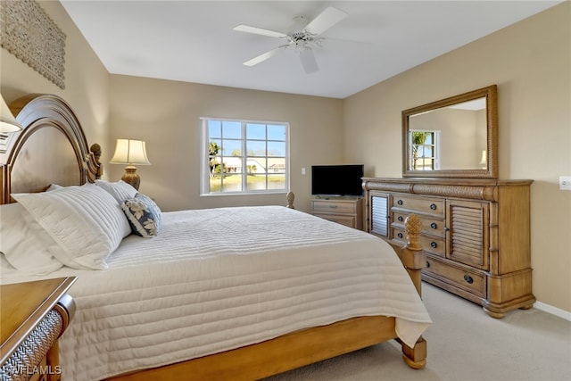 bedroom with multiple windows, carpet, and ceiling fan