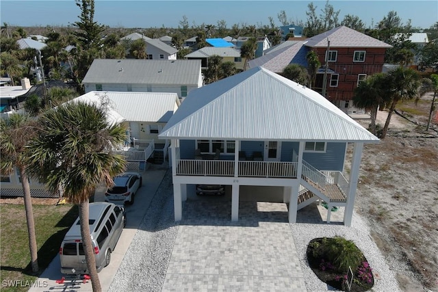 rear view of property with covered porch