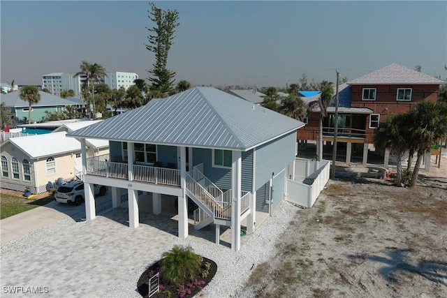 rear view of house with a carport