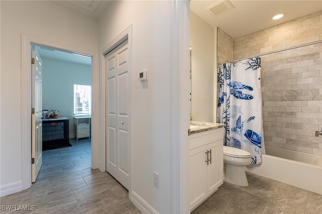 full bathroom featuring toilet, vanity, and shower / bathtub combination with curtain