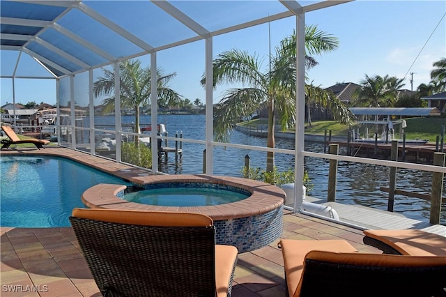 view of pool featuring a dock, a water view, a lanai, an in ground hot tub, and a patio