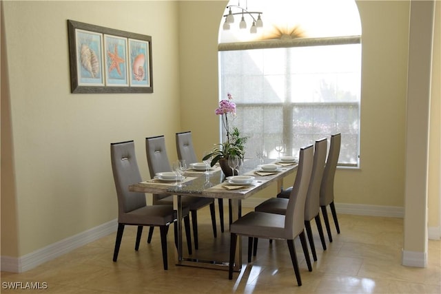 dining room with light tile patterned flooring