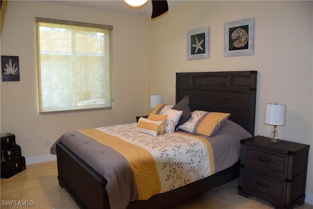 bedroom featuring light tile patterned flooring