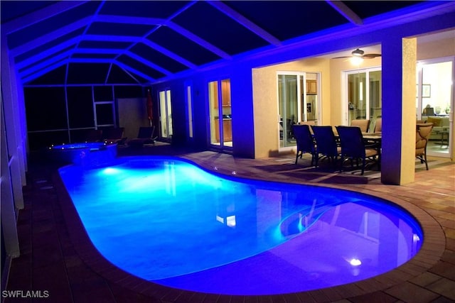 view of pool with ceiling fan, french doors, and a patio