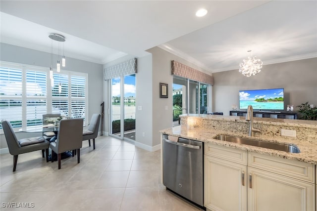 kitchen with light stone countertops, sink, hanging light fixtures, stainless steel dishwasher, and a notable chandelier