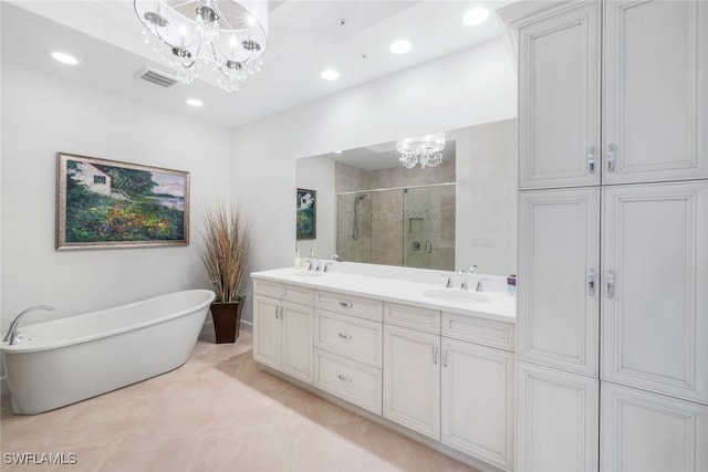 bathroom featuring tile patterned floors, vanity, plus walk in shower, and a notable chandelier