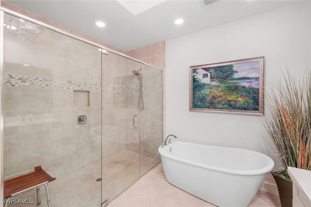 bathroom featuring vanity and separate shower and tub