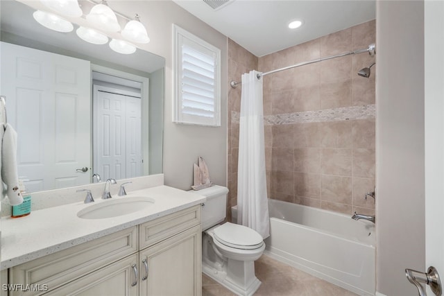 full bathroom featuring tile patterned floors, vanity, toilet, and shower / tub combo