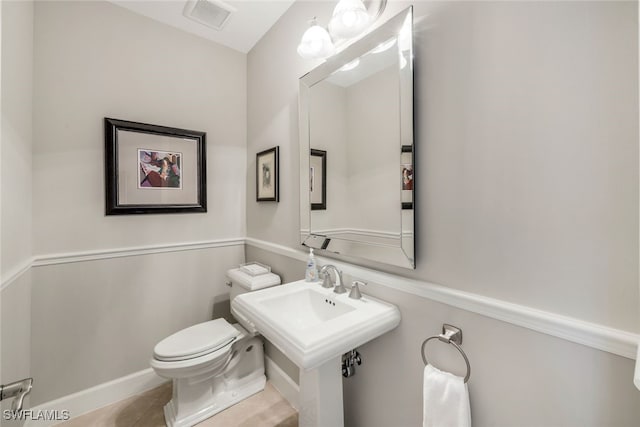 bathroom with tile patterned floors and toilet