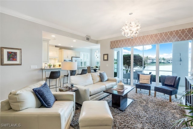 living room with crown molding and a notable chandelier