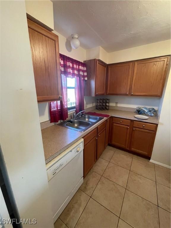 4861 Regal, Bonita Springs, FL 34134 - kitchen featuring dishwasher, light tile patterned flooring, and sink