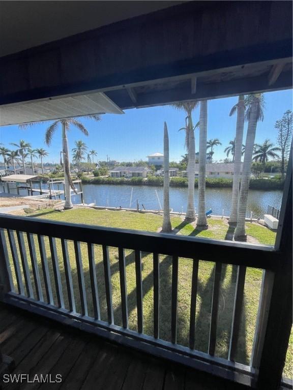 4861 Regal, Bonita Springs, FL 34134 - wooden terrace featuring a yard and a water view