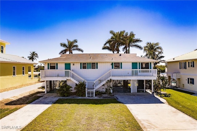 4861 Regal, Bonita Springs, FL 34134 - view of front of house featuring a carport and a front lawn