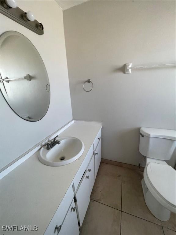 4861 Regal, Bonita Springs, FL 34134 - bathroom featuring tile patterned floors, vanity, and toilet