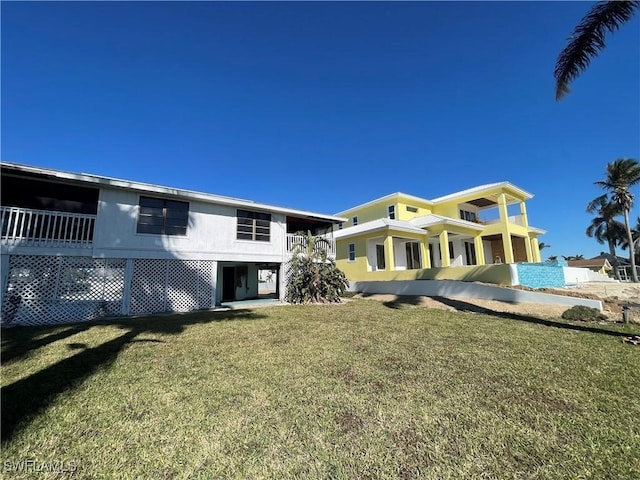 4861 Regal, Bonita Springs, FL 34134 - view of front of house featuring a balcony and a front lawn