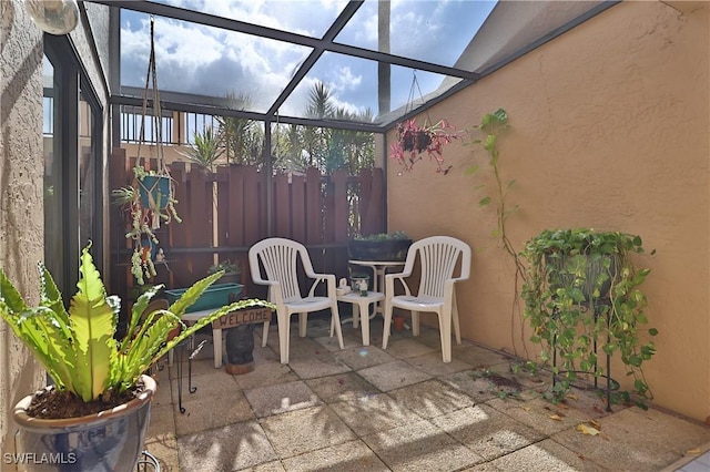 view of patio / terrace with a lanai