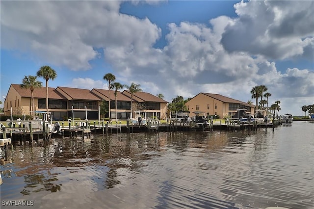 view of water feature featuring a dock and a residential view