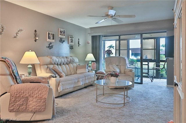 carpeted living room with ceiling fan