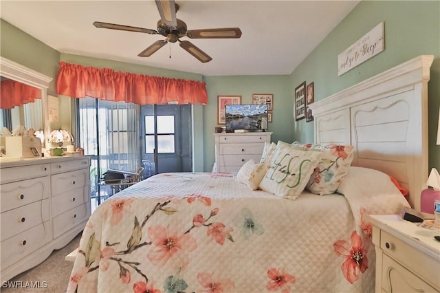 bedroom with light carpet, access to outside, and ceiling fan