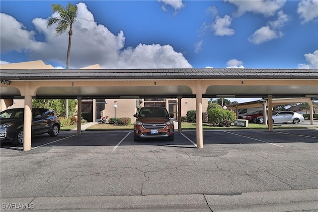 view of parking with a carport