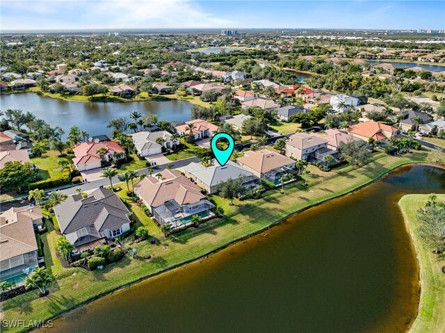 aerial view featuring a water view and a residential view