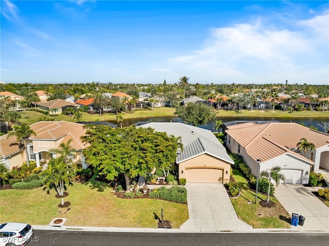 bird's eye view with a water view and a residential view