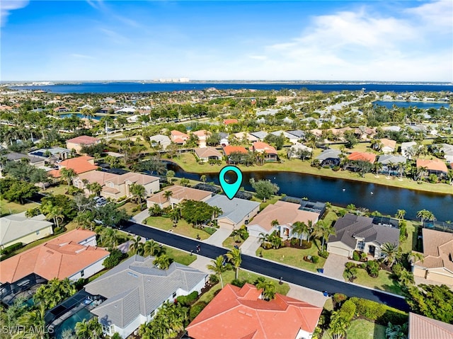 aerial view with a water view and a residential view