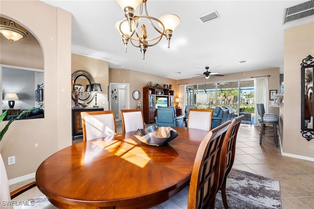 dining room with light tile patterned floors, baseboards, visible vents, and ceiling fan with notable chandelier