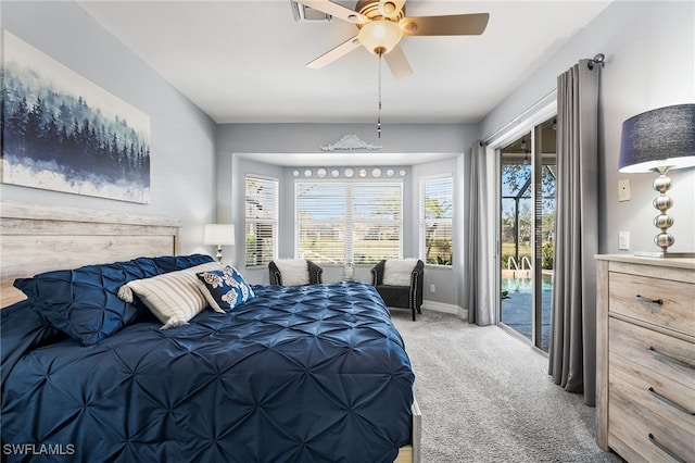 carpeted bedroom featuring access to outside, baseboards, and a ceiling fan