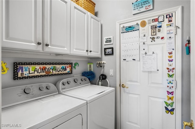 laundry room featuring cabinet space and washer and clothes dryer