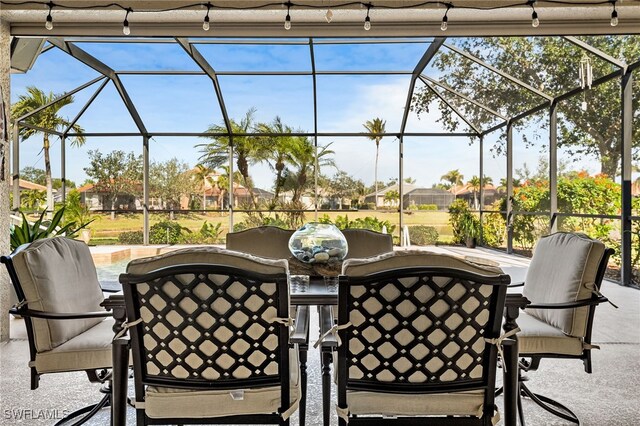 view of patio / terrace with a lanai