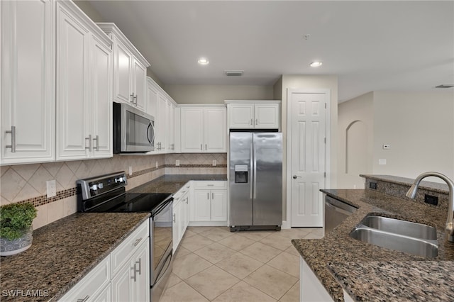 kitchen with white cabinets, appliances with stainless steel finishes, and sink