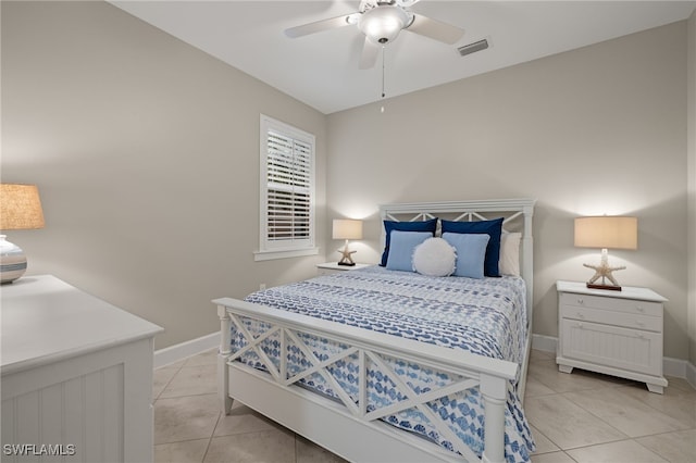 tiled bedroom with ceiling fan