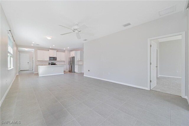 15133 Ligustrum Ln, Alva, FL 33920 - unfurnished living room with a ceiling fan, baseboards, light tile patterned floors, and recessed lighting