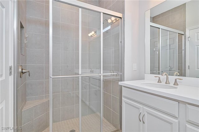 bathroom with vanity and walk in shower