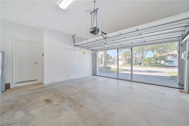 garage with a garage door opener and water heater