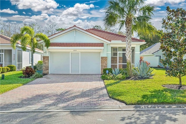 15133 Ligustrum Ln, Alva, FL 33920 - view of front facade with stone siding, a front lawn, and a tiled roof