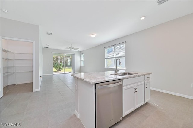 kitchen with light stone countertops, sink, a center island with sink, dishwasher, and white cabinetry