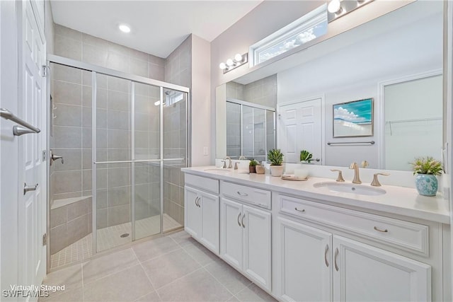 15133 Ligustrum Ln, Alva, FL 33920 - full bath with double vanity, a shower stall, and tile patterned floors