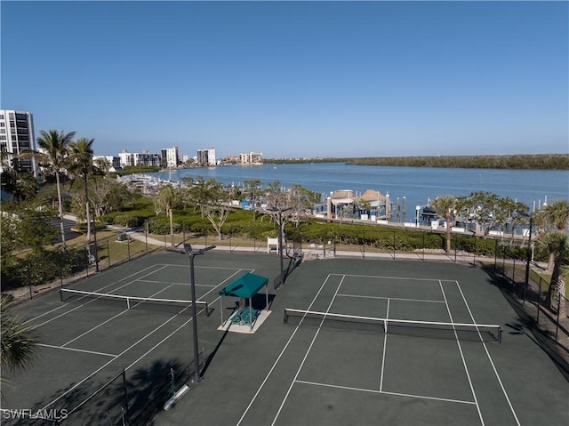 view of sport court featuring a water view