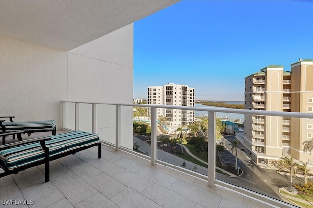 balcony featuring a water view